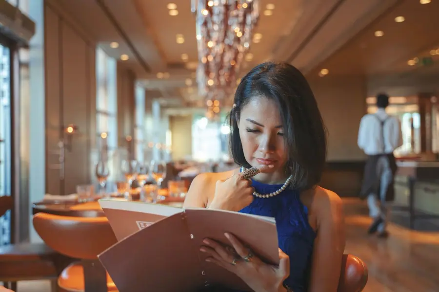 Restaurant staff taking a payment